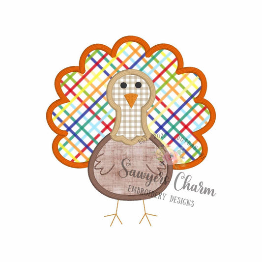 Colorful plaid turkey design with 'Sawyer Charm Embroidery Designs' text on a white background
