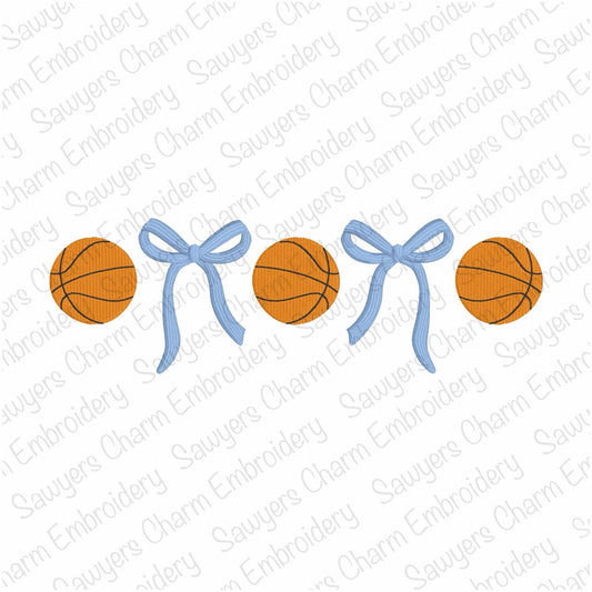 Two basketballs and two blue bows arranged in a row on a white background with 'Sauyer's Charm Embroidery' watermark.