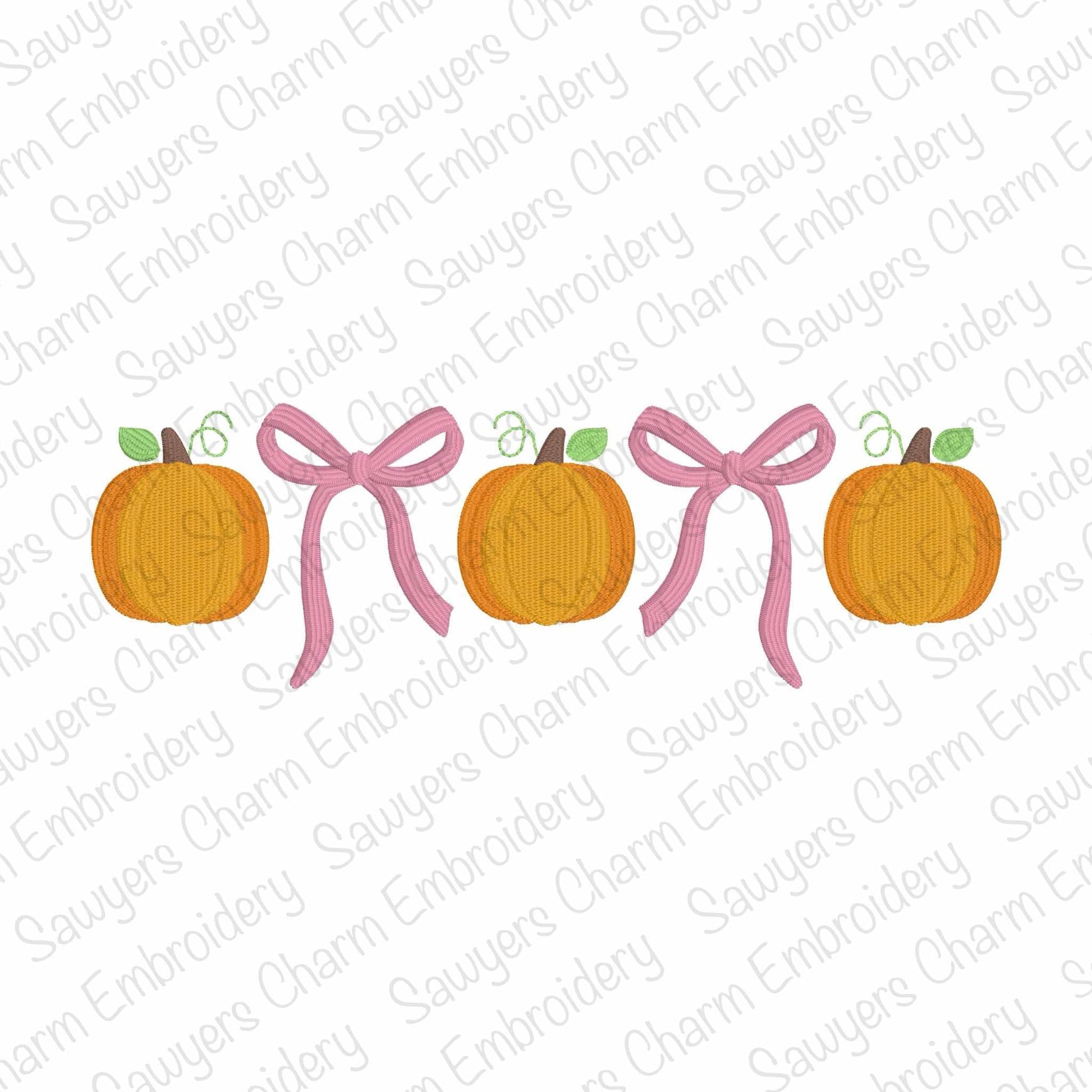 Two pumpkins with pink ribbons on a white background with 'Sauyer's Charm Embroidery' watermark.