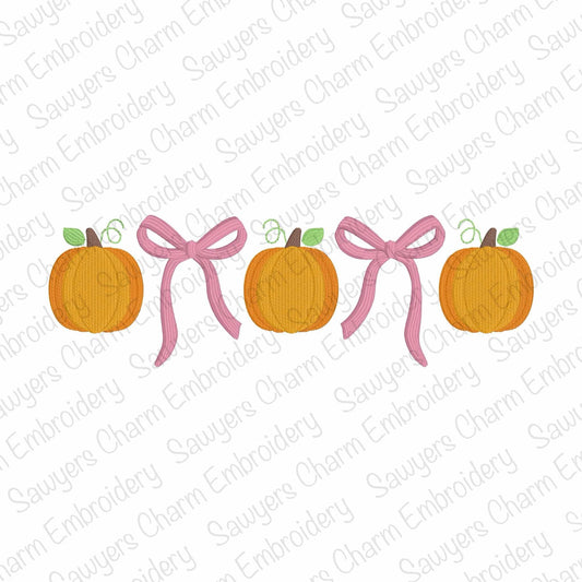 Two pumpkins with pink ribbons on a white background with 'Sauyer's Charm Embroidery' watermark.