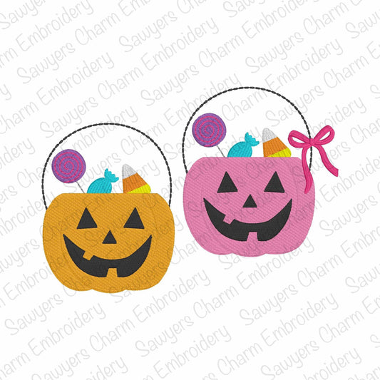 Two Halloween-themed candy buckets, one orange and one pink, on a white background with 'Sauyer's Charm Embroidery' watermark.