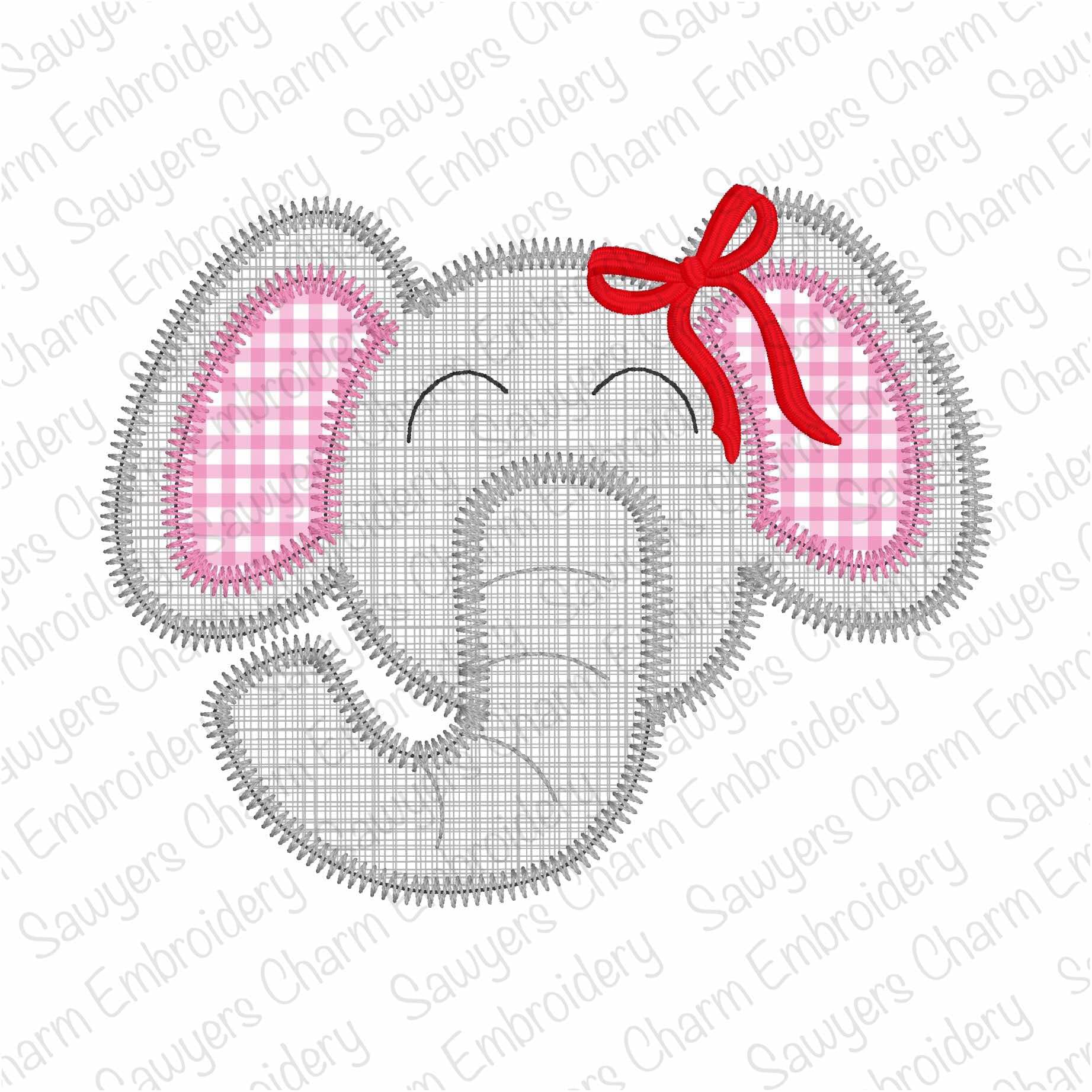 Embroidered design of an elephant head with pink checkered ears and a red bow on a white background.