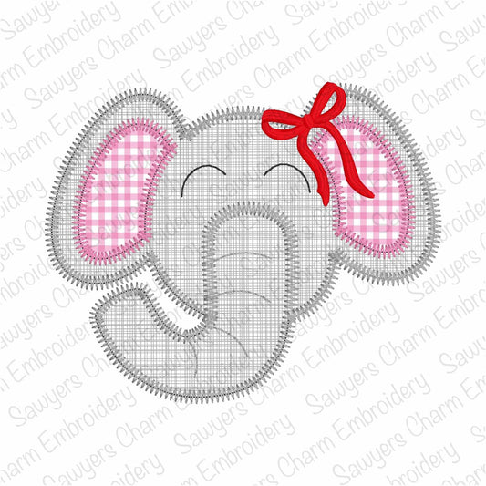 Embroidered design of an elephant head with pink checkered ears and a red bow on a white background.