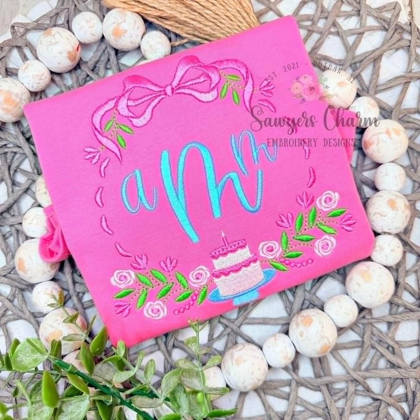 Floral birthday monogram frame, satin stitch/fill stitch machine embroidery design, coquette bow, crest, ribbons, cake, candle, laurel